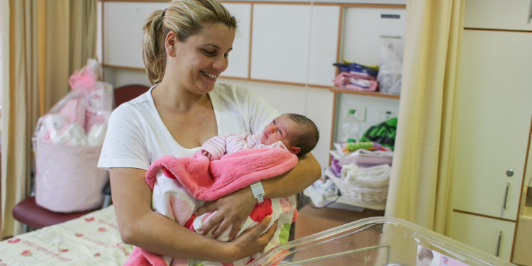 Mother holding her baby girl at the Barzilai medical center.