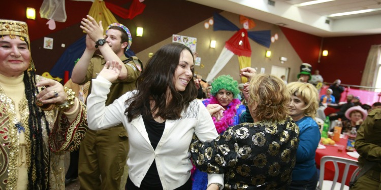 Yael, IDF, and elderly at Purim party