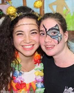Two women dressed up in Purim costumes.