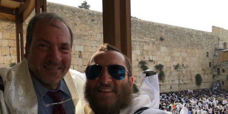 Rabbi Eckstein and a person together at the Western Wall.