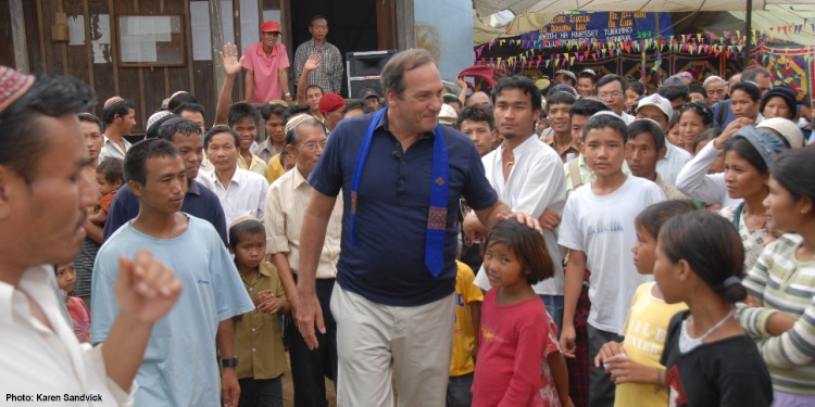 Rabbi Eckstein greeting a crowd of children.