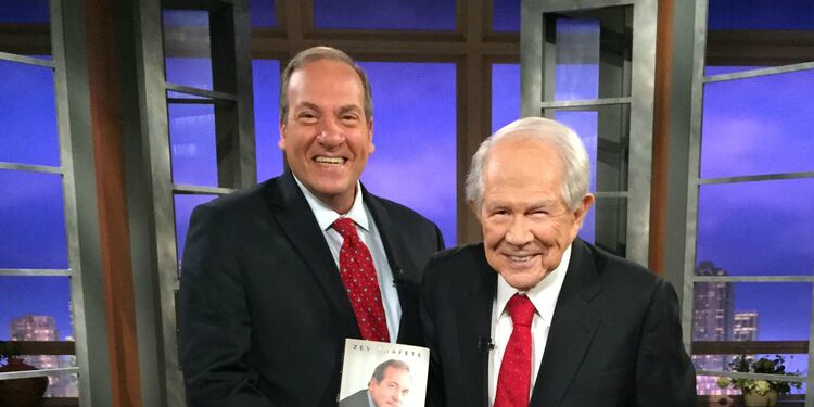 Rabbi Eckstein with Pat Roberston while holding his book.