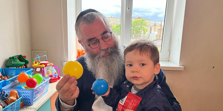 Rabbi and child