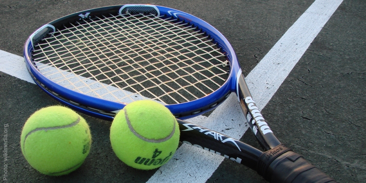 Tennis racket and two balls