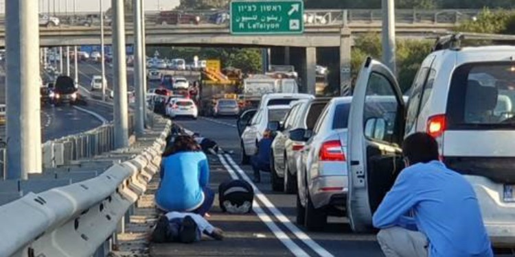 Israelis seek cover during rocket attack, November 12, 2019