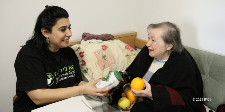 Alla, an elderly Holocaust survivor from Ukraine, receives Passover food box from The Fellowship