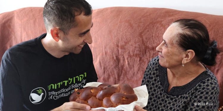 Holocaust survivor receives food from The Fellowship. Sderot, Israel.