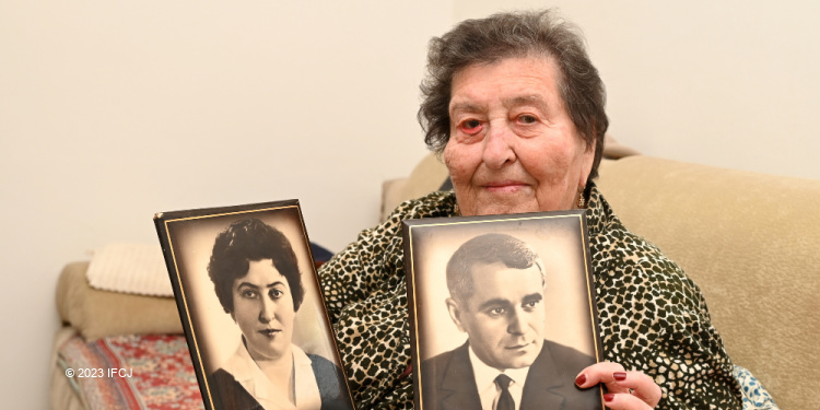 Manya, an elderly Holocaust survivor from Ukraine who finds warmth from The Fellowship
