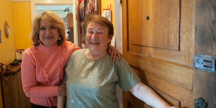 Netta Teplitskaya, smiling standing next to another woman.