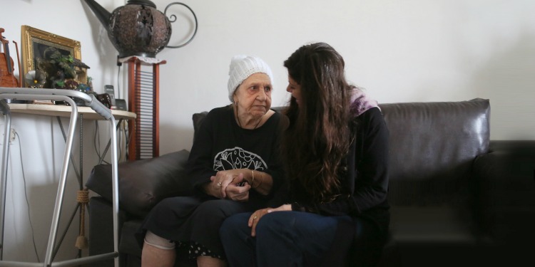 IFCJ coordinator volunteer with elderly woman