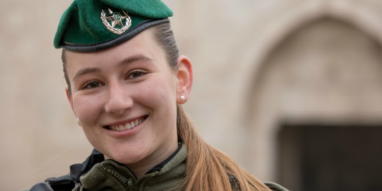 Talia Starr in uniform smiling directly at the camera.