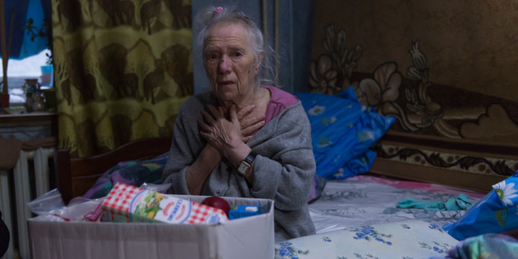 Zhana, an elderly Jewish woman in war zone in Ukraine
