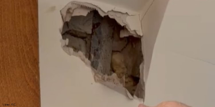 The hole left the rocket that didn't explode after hitting the synagogue in Kherson.