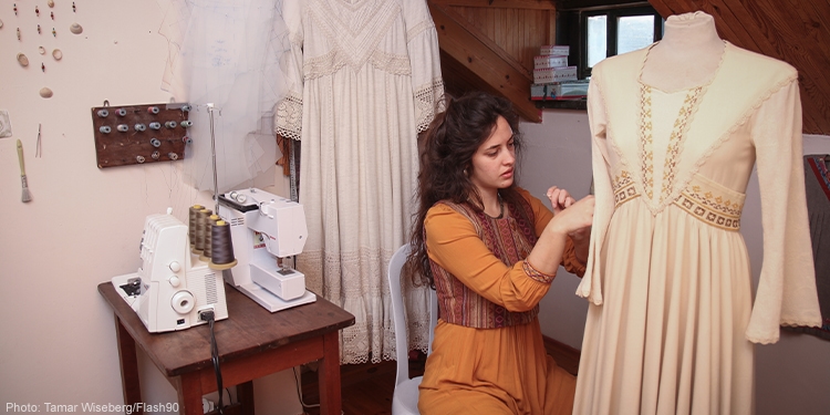 Artist Malka Rivka seen sewing a wedding dress at her studio in the Jewish settlement of Bat Ayin in Gush Etzion