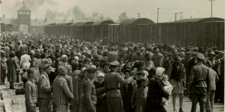 Jews being unloaded from a cattle car at Auschwitz-Birkenau, May 1944 during the Holocaust