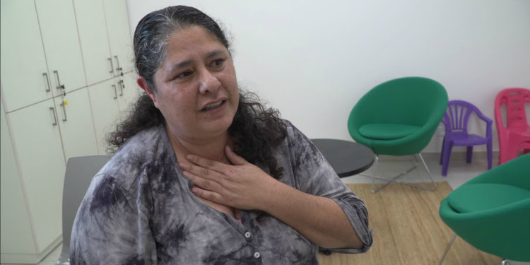 Woman sitting inside the Sha'ar HaNegev Trauma Center.