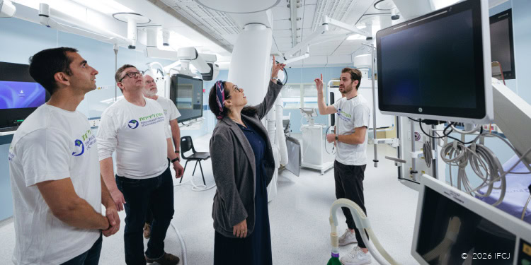 A diverse team of healthcare professionals and a woman are engaged in a discussion about cutting-edge medical technology in a state-of-the-art hospital setting.:
