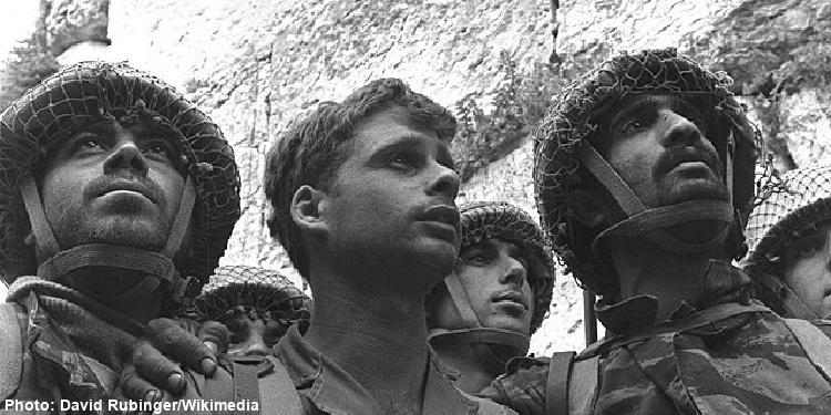 Soldiers standing next to the Western Wall after the Six Day War in Israel. 