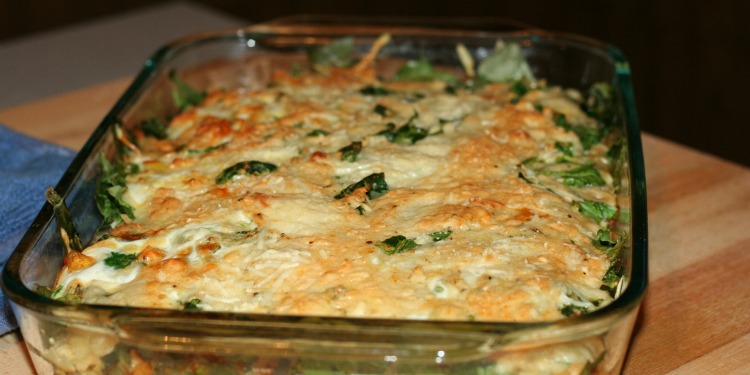Close up image of spinach casserole in a pan.