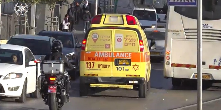 Ambulance carries woman stabbed in terror attack, December 8, 2021