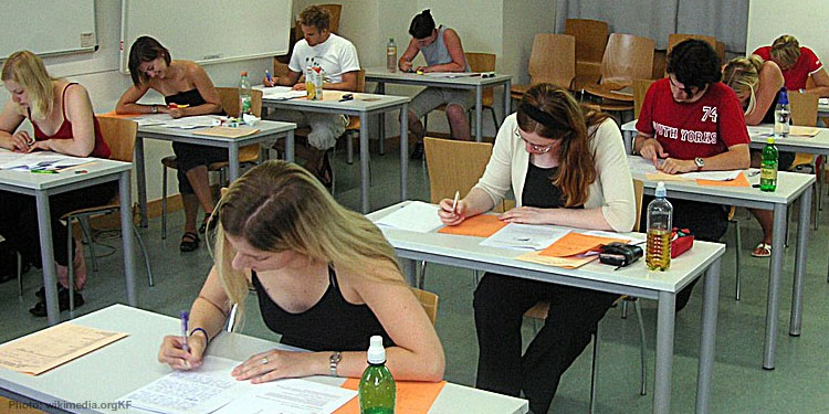 Students sitting in a classroom taking a test