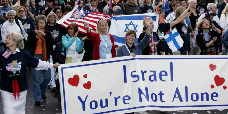 People displaying Israel and America's bond at the Sukkot march
