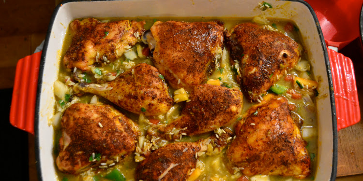 Sumac chicken and rice in a red pan.