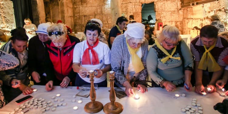 Holocaust survivors gathered together celebrating their bar and bat mizvahs.