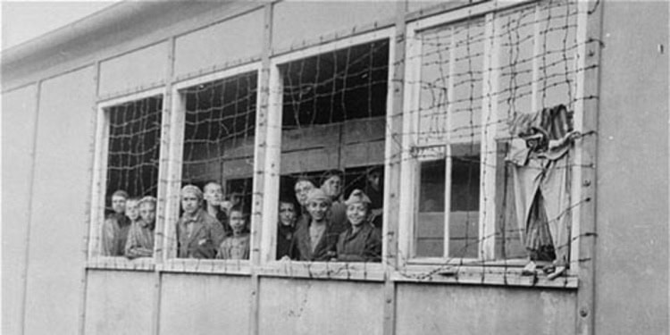 Holocaust survivors in a barracks at Dachau concentration camp