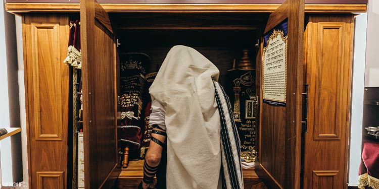 Man praying in a synagogue
