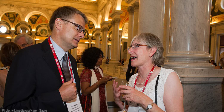 Two people laughing and talking