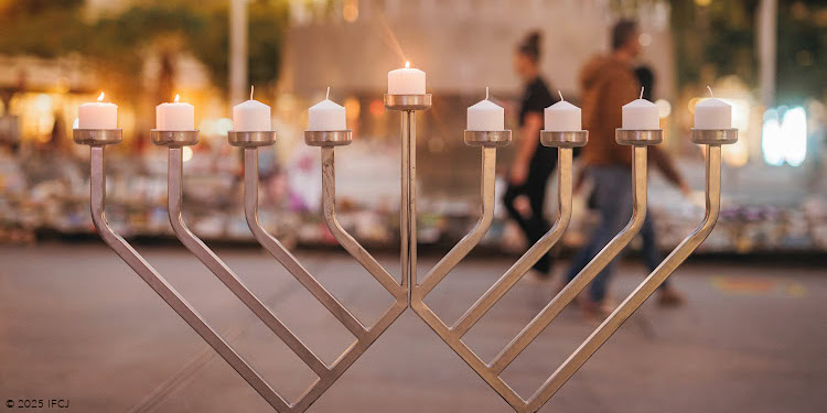 menorah in front of the fountain at Dizengoff Square - memorial - center candle lit
