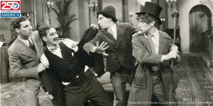 Performers dressed in vintage costumes act out a theatrical scene, showcasing expressive gestures and period attire, highlighting classic entertainment and performing arts.