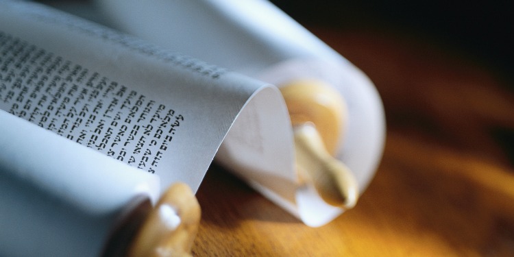 Close up image of a scroll on a table.