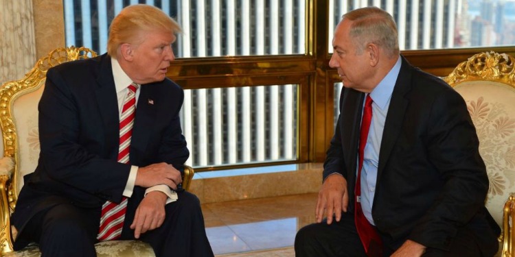 President Trump and Bibi having a discussion in two white and gold chairs.