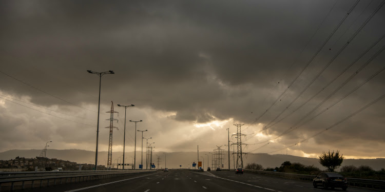 Storm brewing overhead an empty highway.