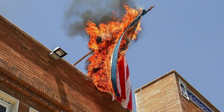 American flag burned in Iran, marking embassy takeover