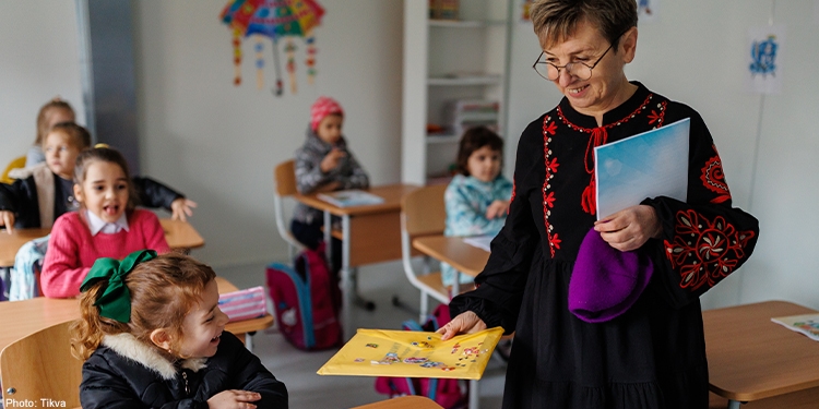 Ukranian children in classroom with teacher