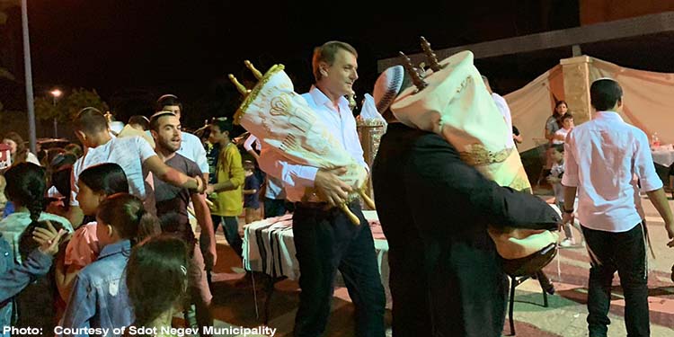 Dancing with the Torah scrolls at Simchat Torah