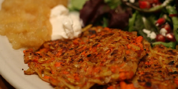 A plate of vegetable pizza latkes