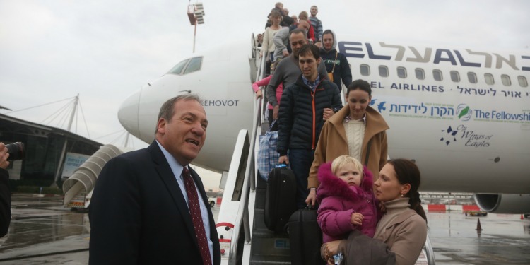 Rabbi Eckstein greeting people coming off of an Aliyah flight.