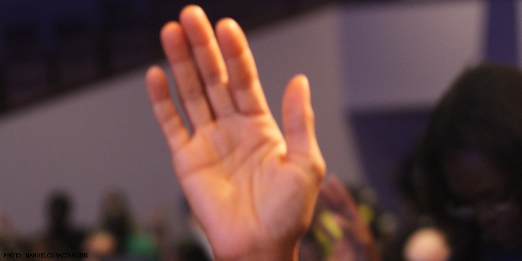 Hands lifted up in praise at church.