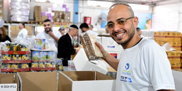 Yad BYad Passover food box packing by volunteers.