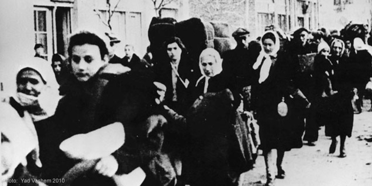 A dated black and white image of women walking