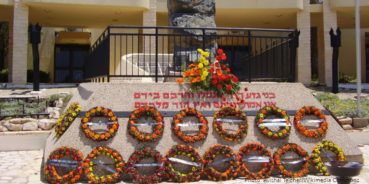 Memorial wreaths laid at Yom HaZikaron remembrance site with flowers honoring fallen soldiers and victims of terror in Israel.