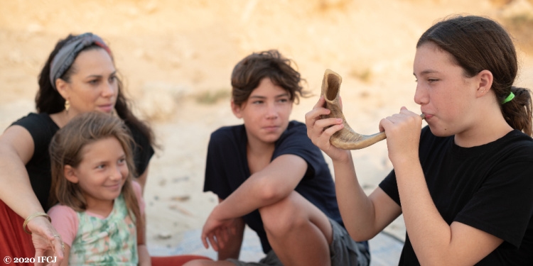 Yael Eckstein and children blow shofar for Rosh Hashanah, the Jewish New Year