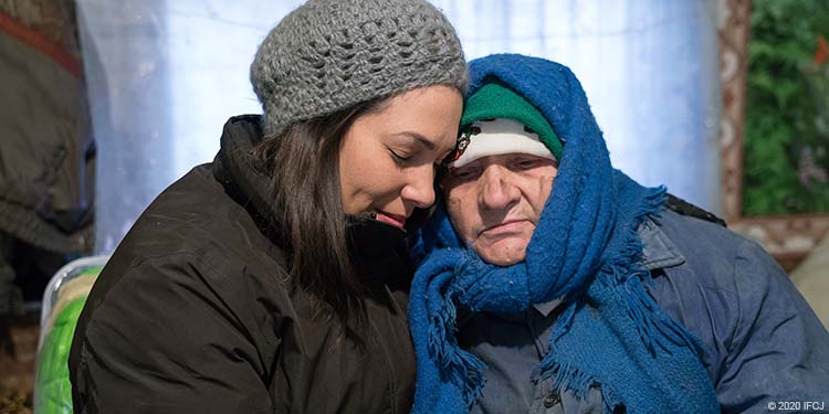 Yael with elderly woman Olga with dirt smudges on her face