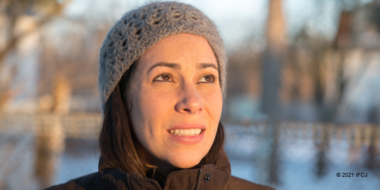 Yael Eckstein looking up praying in winter