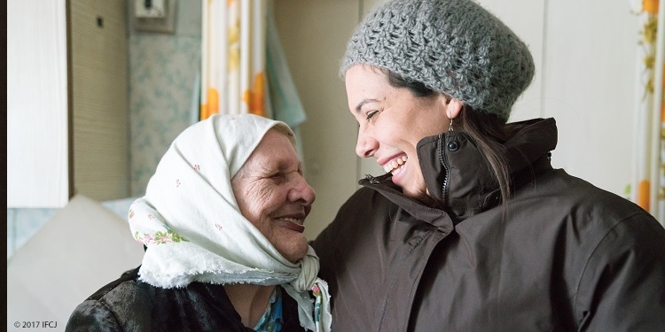 Yael with elderly woman in Ukraine