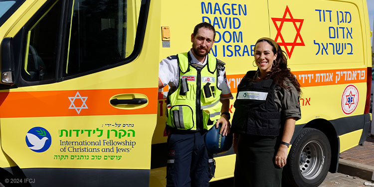 Yael and medic with yellow armored ambulance